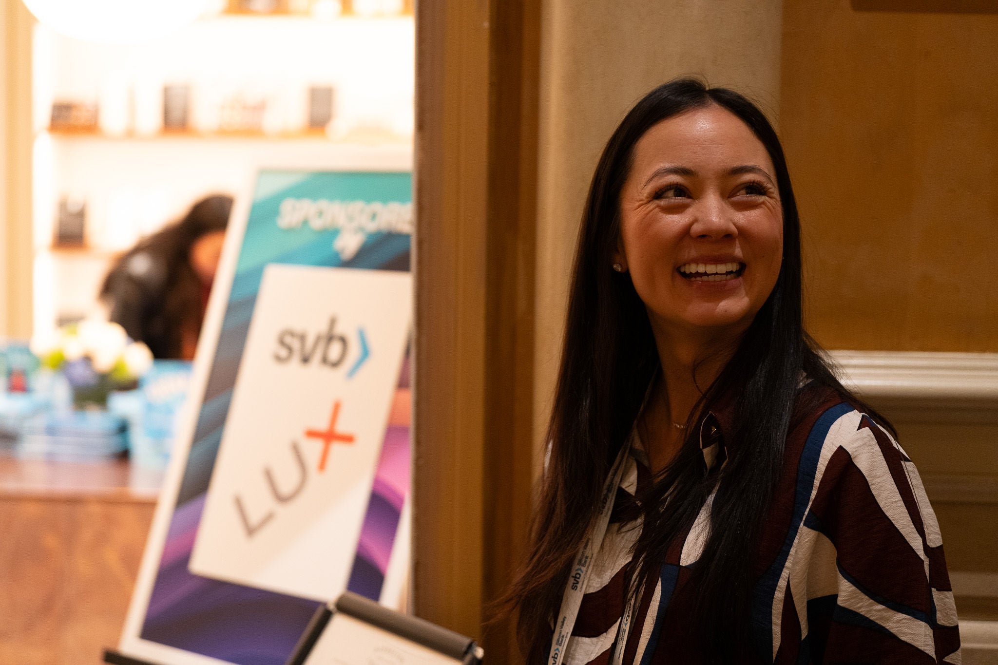 Worker smiling at event