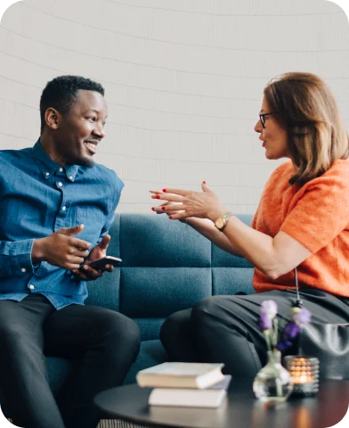 Man and woman talking on couch