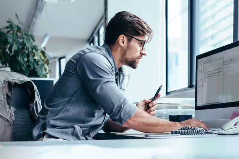 Worker at desktop