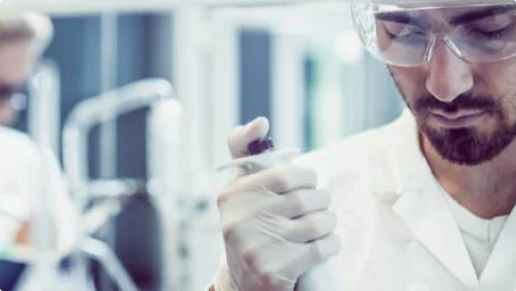 Scientist holding syringe